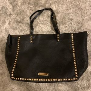 Steve Madden purse. Black exterior with gold studs, camo interior